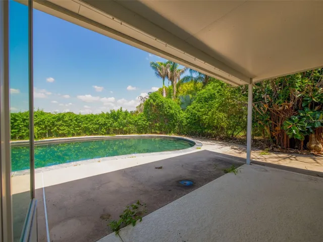 Covered patio overlooking the pool