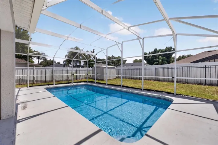 View of pool and backyard