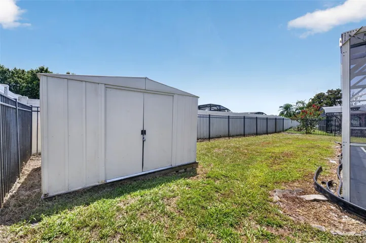 View of shed and backyard