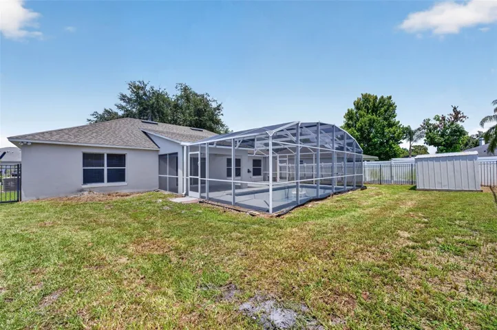 Rear view of home and backyard