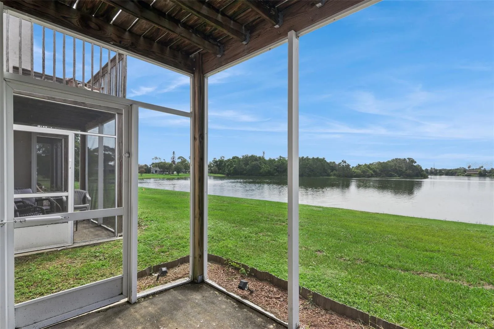 First Floor Covered Patio with view to the pond