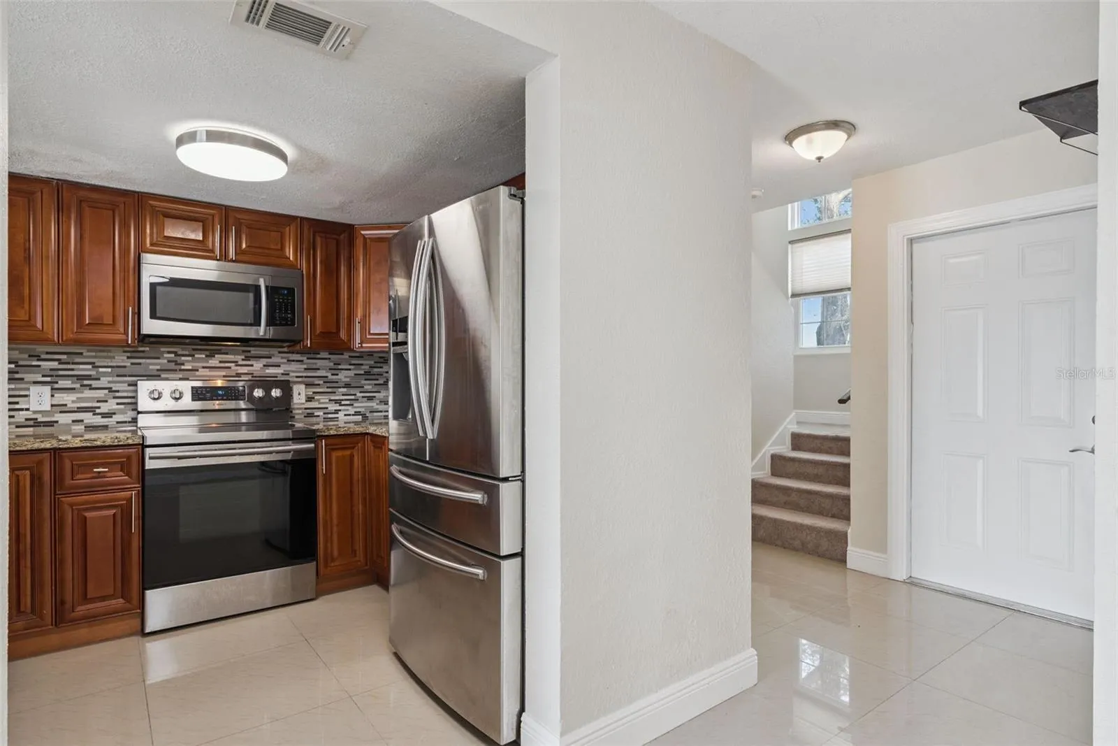Kitchen with Granite Countertops and new Stainless Steel Appliances