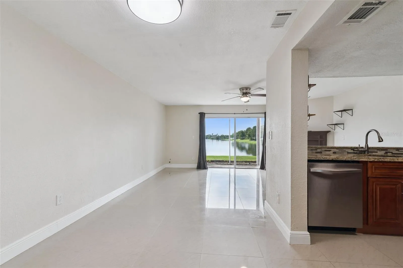 View from Entryway to dining room/kitchen and living room