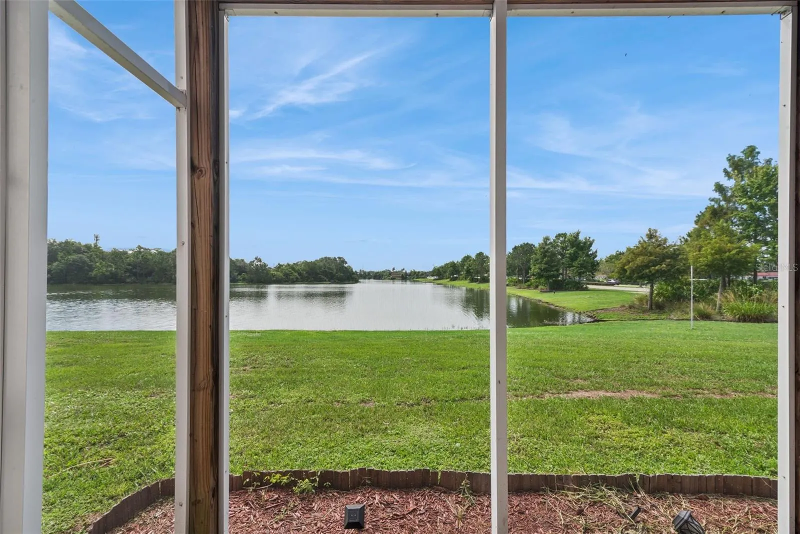 First Floor Covered Patio with view to the pond