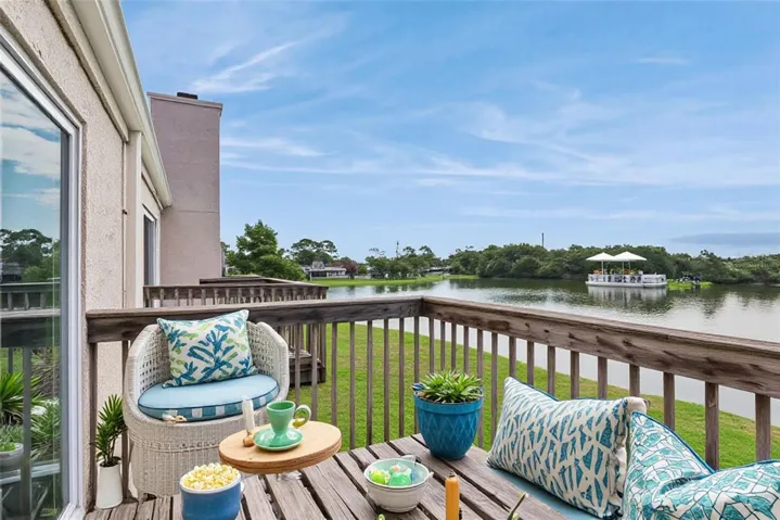Virtually Staged Second Floor Patio with view to the pond