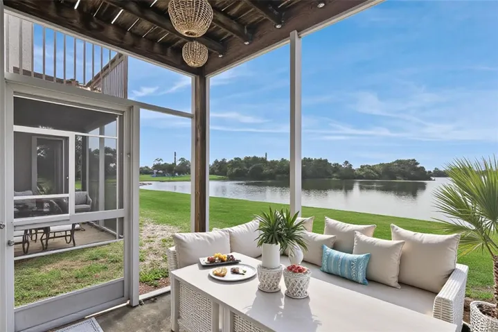 First Floor Covered Patio with view to the pond - Virtually Staged