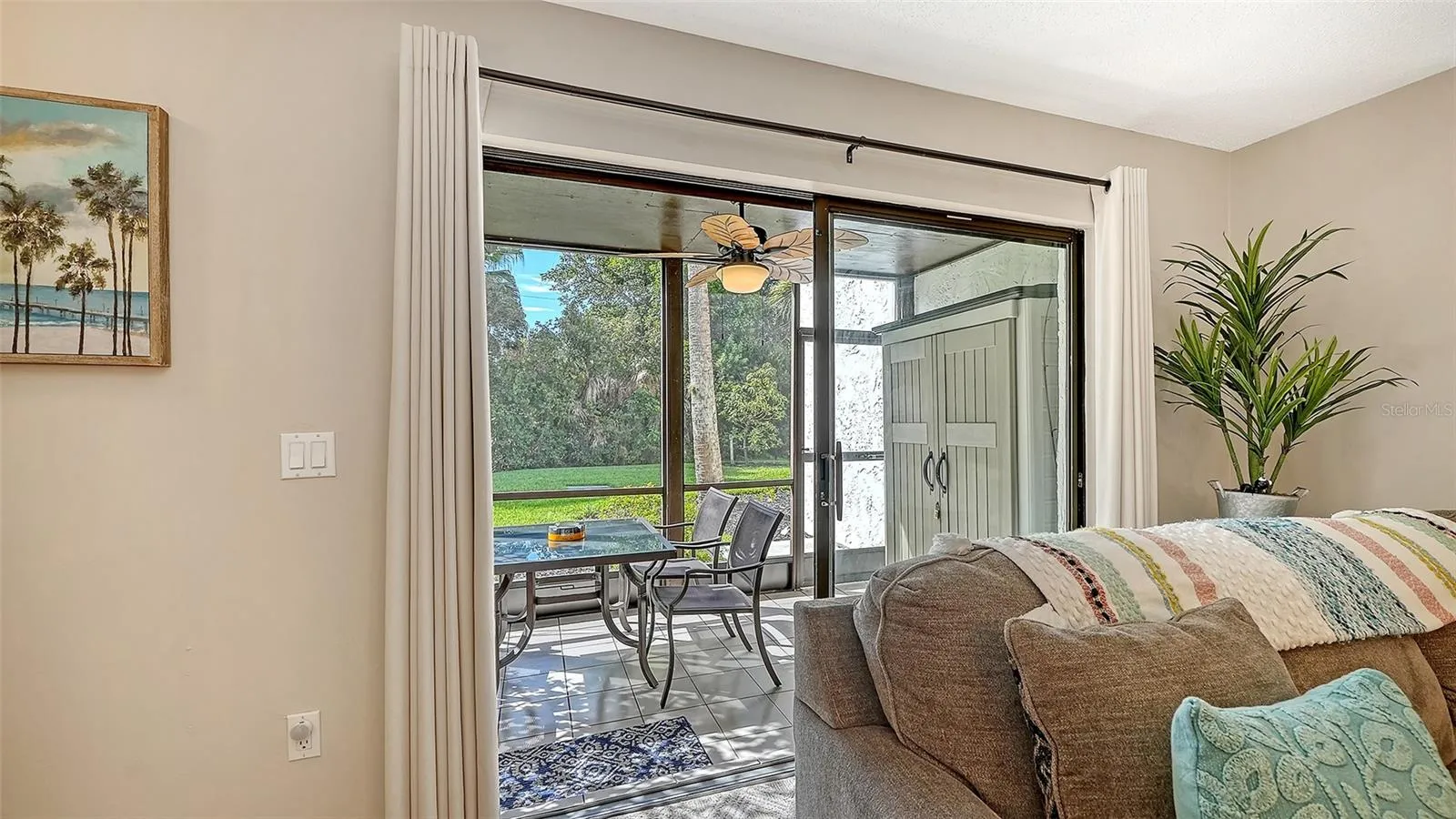 Living Room opens to screened and covered lanai.