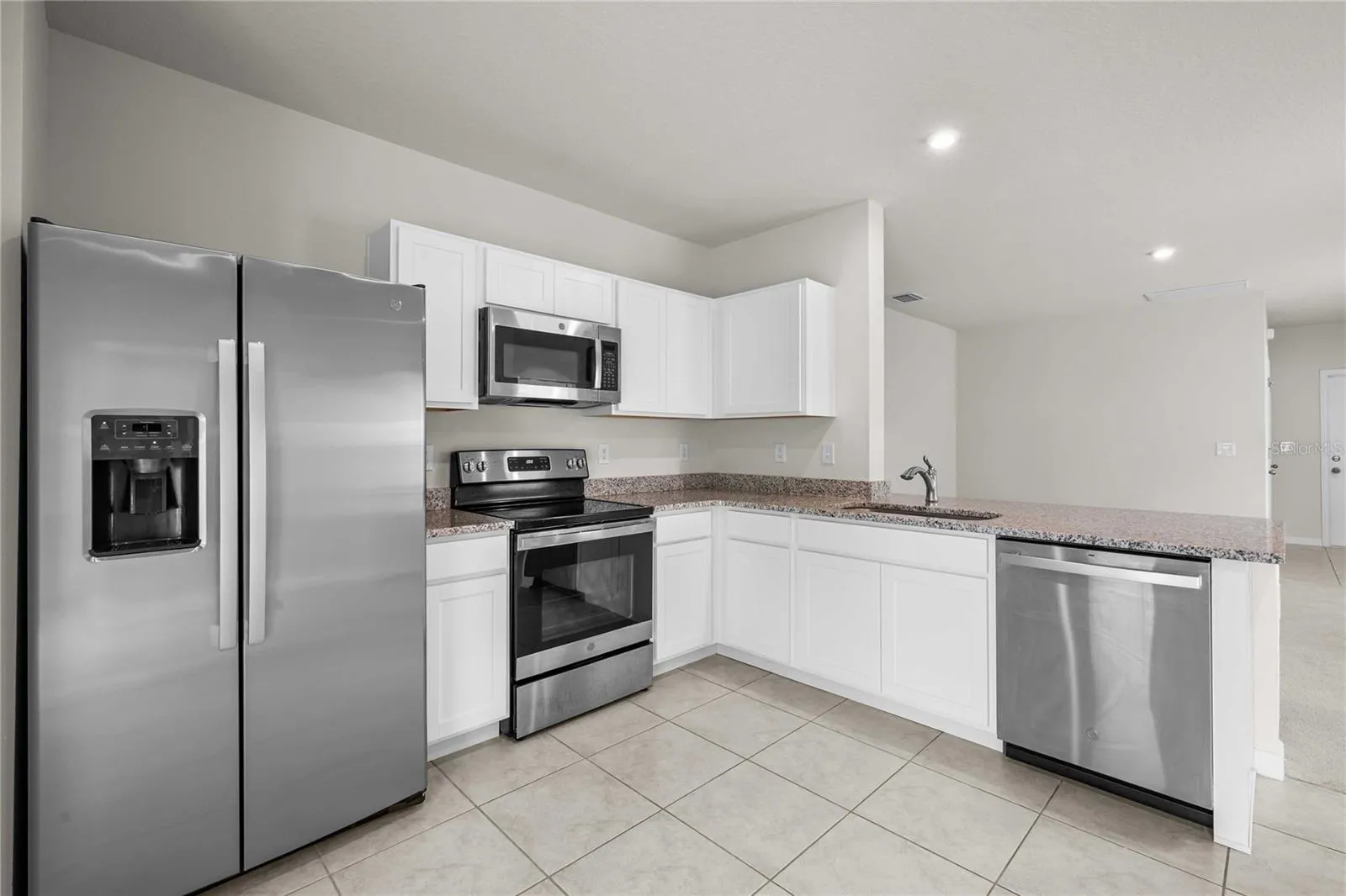 The kitchen has SS appliances