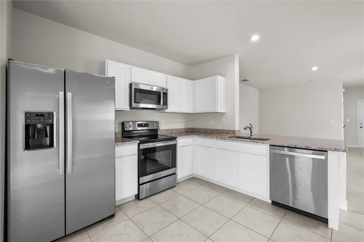 The kitchen has SS appliances