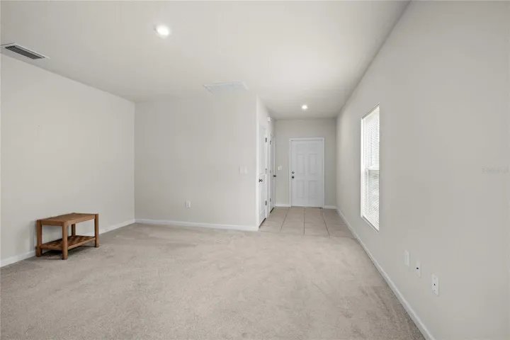 The entry foyer is tiled and has a hall closet with garage access.