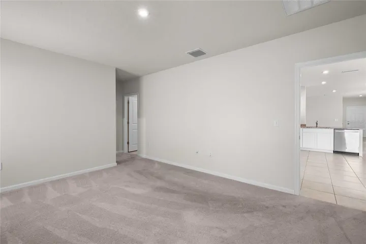 The primary bedroom is at the back off the home off the kitchen