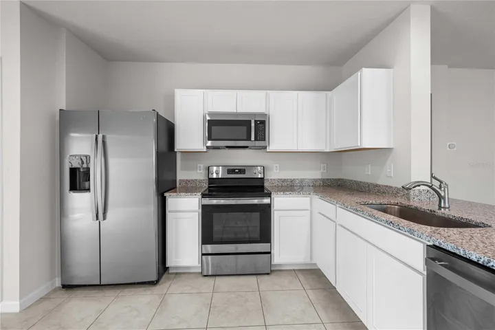 Stylish white mission style cabinets here.