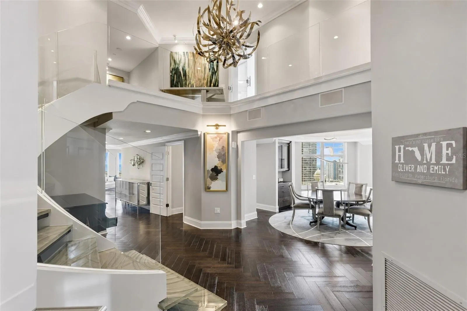 Greeted by a two-story great room, 1900 is a two story penthouse that has been completely renovated with gorgeous walnut herringbone floors.