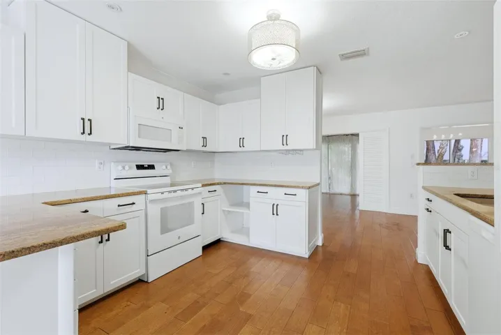 OPEN KITCHEN WITH HARD WOOD FLOORS
