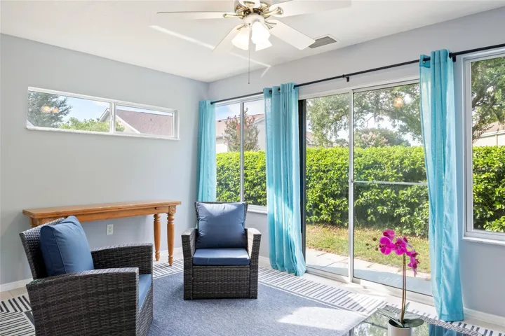 Florida Room with privacy shrubs in the back yard.