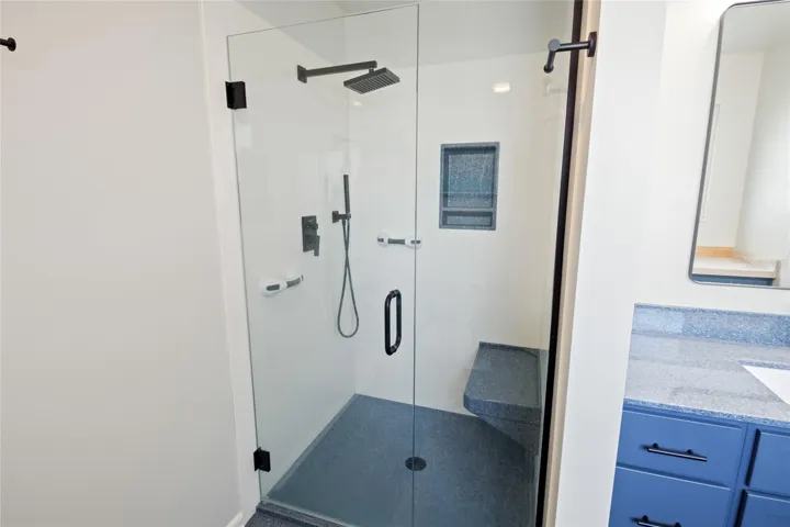 Master bathroom with walk in shower with seat.