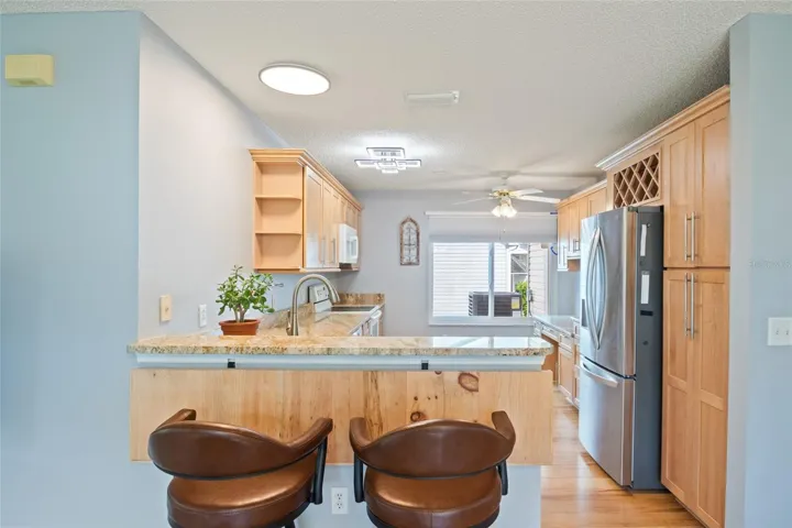 Kitchen bar has a wood extender that allows for the convenience of having it down or up.
