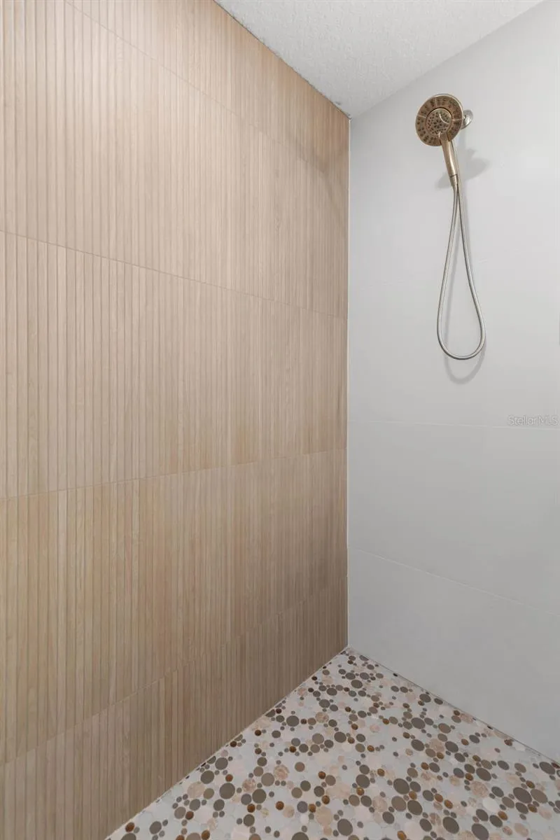 Custom shower details including Delta Arvo Two-in-One Shower System