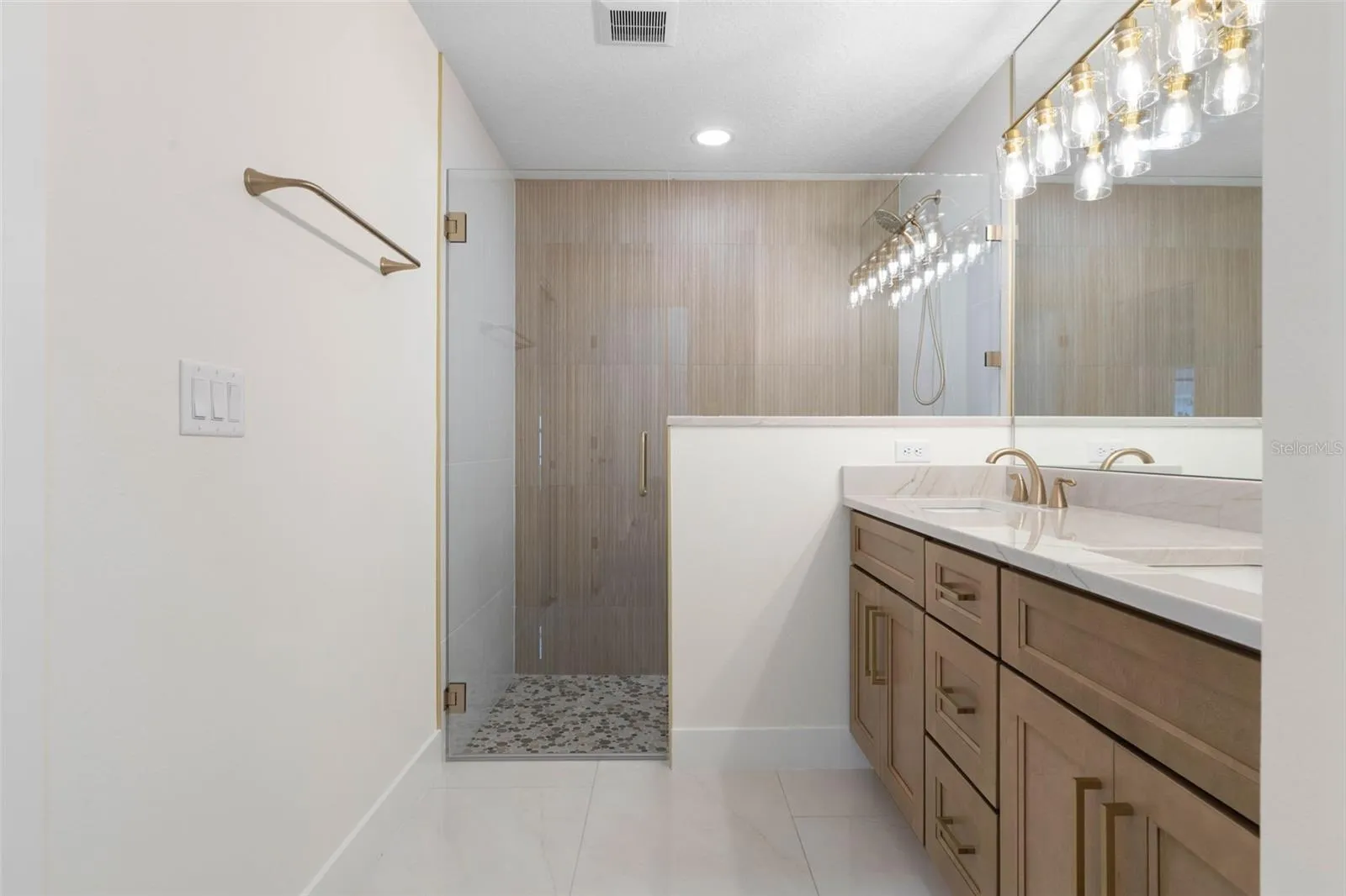 Premium Quartzite tops & elegant framless shower enclosure