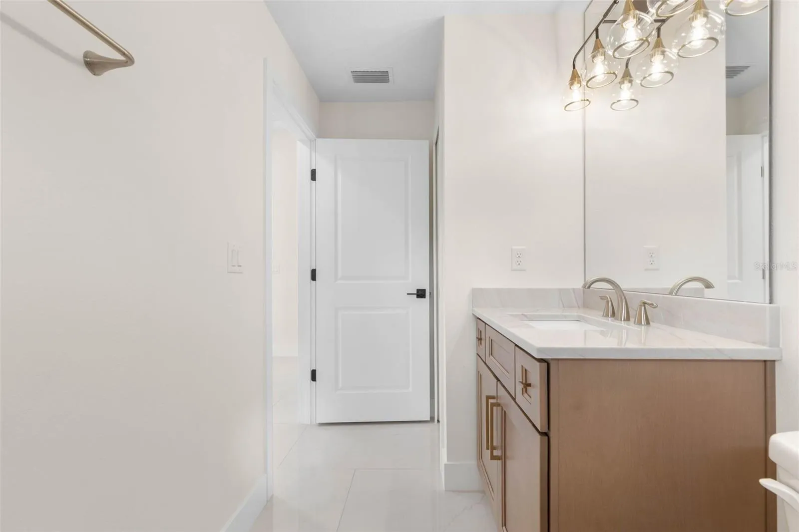 Bath 2 Quartzite Tops, undermount sink,  Widestread Delta Arvo faucet, delta towel bar