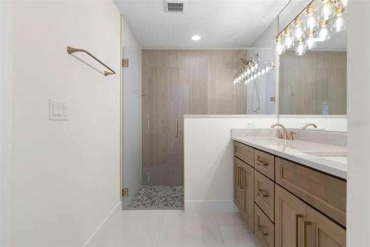 Premium Quartzite tops & elegant framless shower enclosure