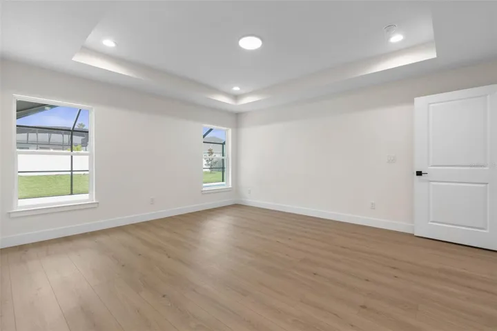 Primary bedroom looking to pool