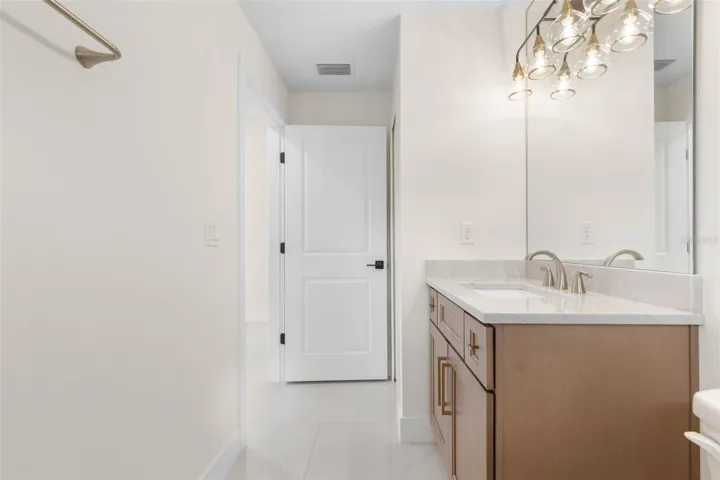 Bath 2 Quartzite Tops, undermount sink,  Widestread Delta Arvo faucet, delta towel bar