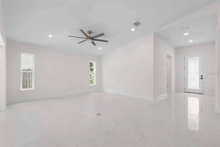 Spacious entry with high ceiling and 8' entry door
