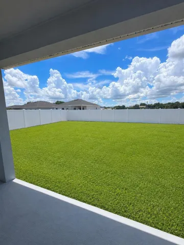 Beautiful Back yard with lanai and fence