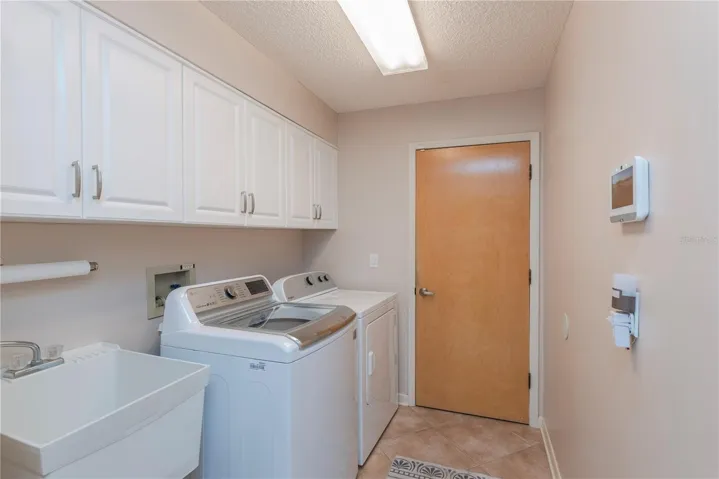 Laundry room with utility sink.