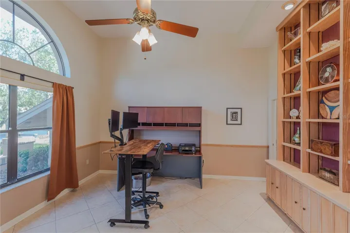 Executive office with arched window detail.