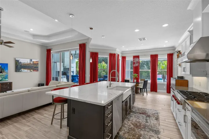Stunning kitchen with Wolf appliances, upgraded Viaterra Quartz countertop on the island and upgraded cabinetry