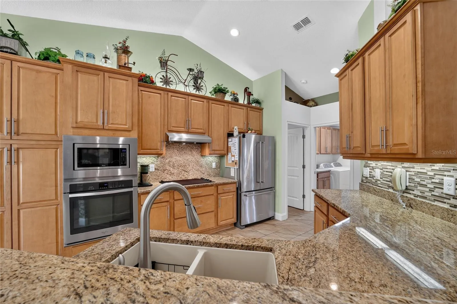 Kitchen from counter top between dinette area