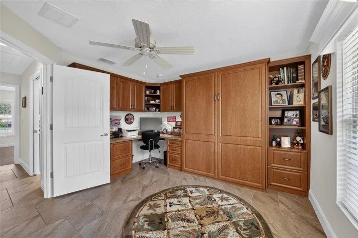 Guest bedroom with built in office and Murphy bed