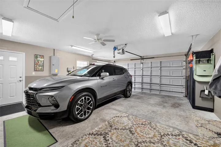Expanded Garage with insulated Garage door and screens