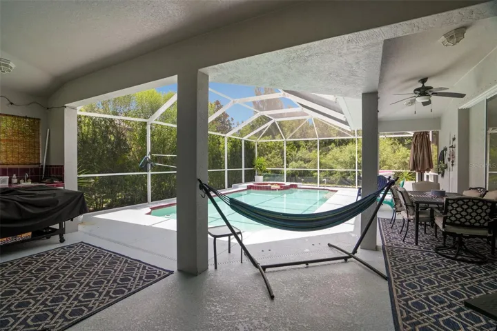 Expansive covering under the screened enclosure