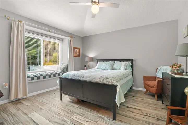 4th bedroom with window seat in the back of the home.
