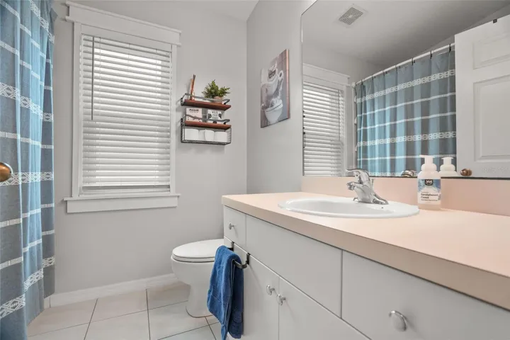 2nd bathroom off kitchen with shower and tub combo
