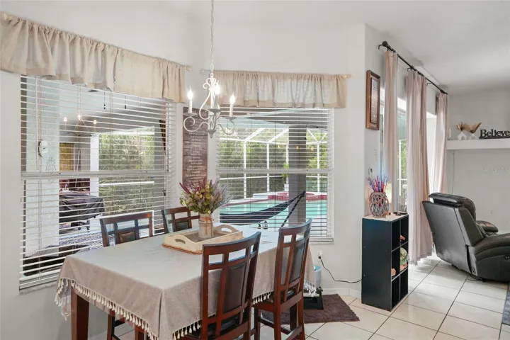 Dining area with sweeping views of the pool!