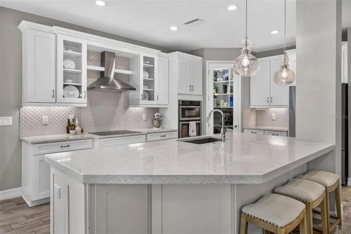 Thick quartz countertops, extended cabinetry, upgraded appliances.