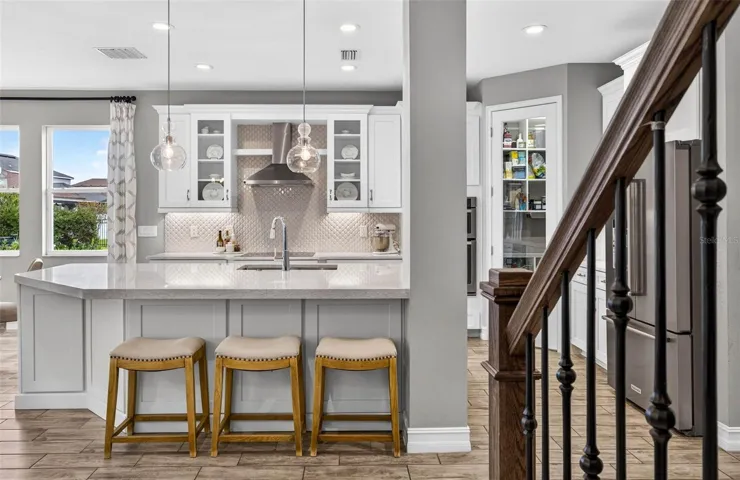Kitchen area with informal island seating.