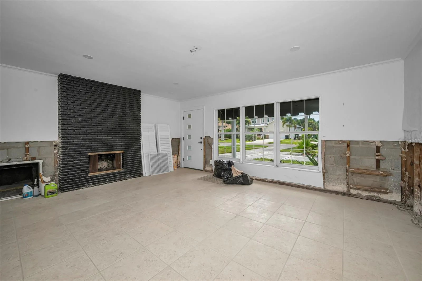 Entrance into family room with wood burning fireplace.