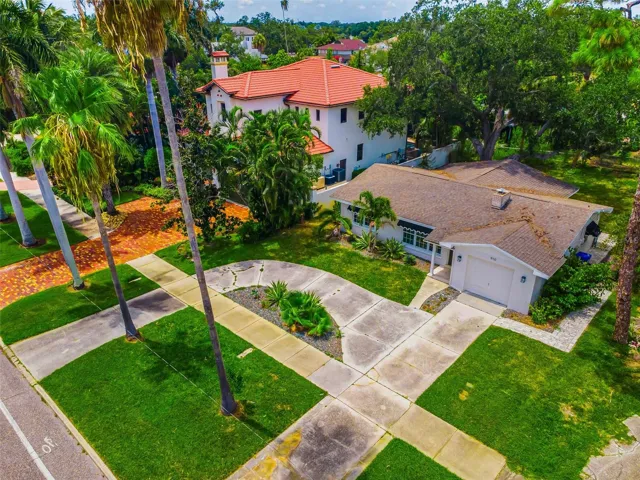 Lush greenery surrounding the property and sidewalks lining the street for the convenience of walking and biking.