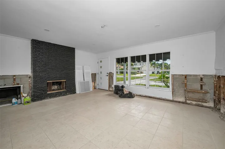 Entrance into family room with wood burning fireplace.