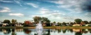 community lake w/ water fountain