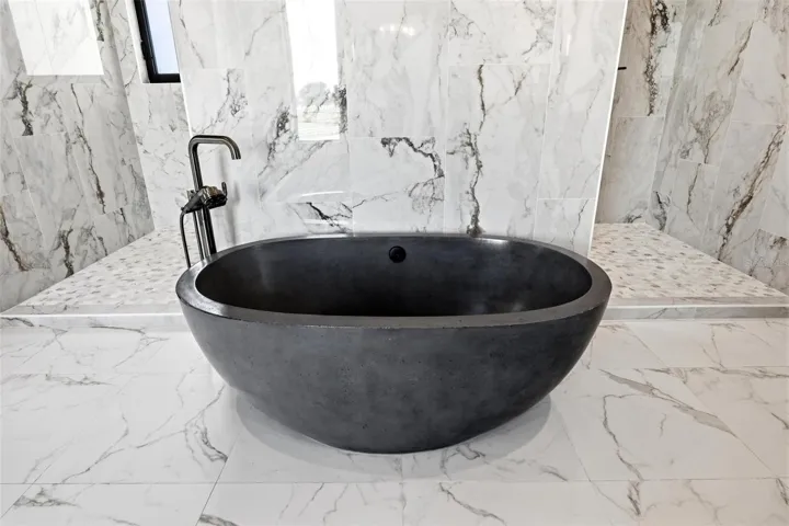 Stone tub in Primary bathroom