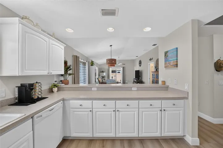 Kitchen looking into dining and living area