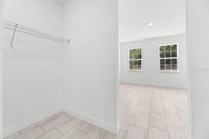 MASTER CLOSET 1 OF 2 AND BEDROOM