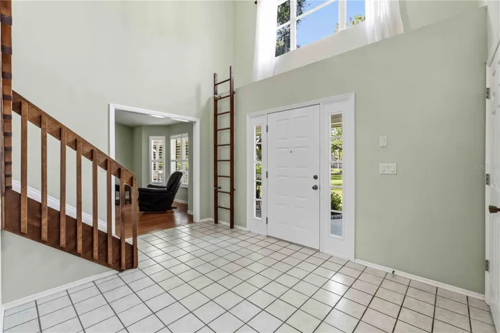 Enter the home onto  ceramic tile foyer