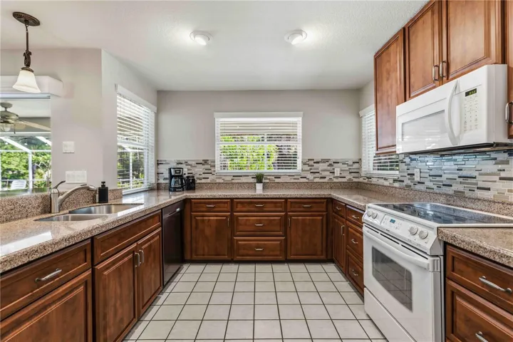 Cherry cabinets, granite counters and lots of space to prepare and entertain! Dining area to the right